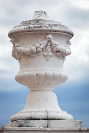decorative vase on the corner of the buildingの写真素材
