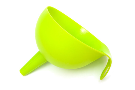 green plastic funnel with a white backgroundの写真素材