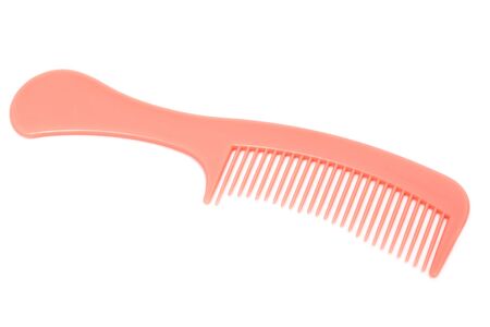pink comb on a white backgroundの写真素材