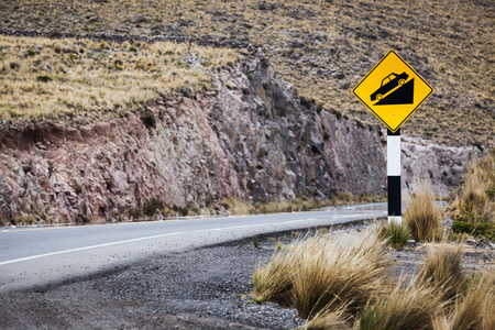 road sign on a mountain roadの写真素材