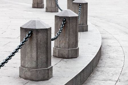 column with a chain on the town squareの写真素材