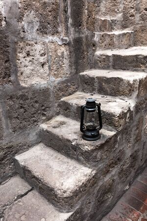 kerosene lamp in a beautiful old staircaseの写真素材