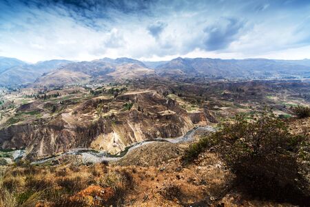 terrace, mountain and river in a sunny dayの写真素材
