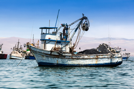 fishing boat in the bay of the Pacific Oceanの写真素材