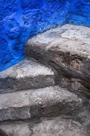 beautiful old steps and blue wallの写真素材