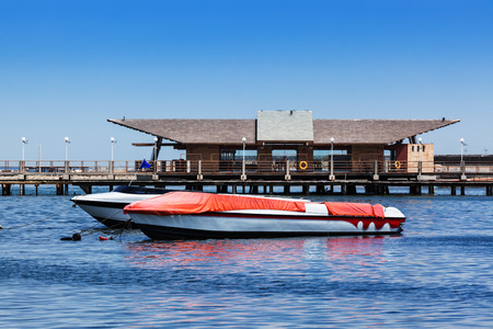 boat at the pier in the bay of the oceanの写真素材