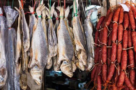 fish and sausage in a street marketの写真素材