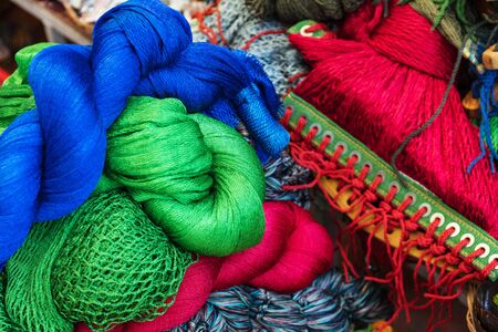 colorful yarn on the market counterの写真素材
