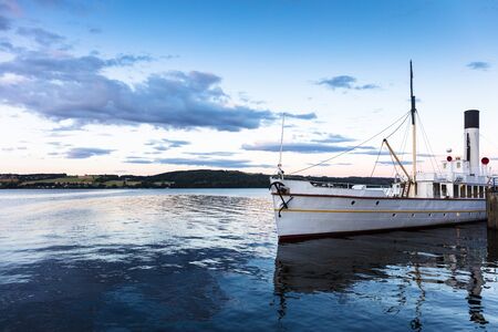 Old steamer on a beautiful lakeの写真素材