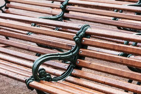 park benches after the rain fallの写真素材