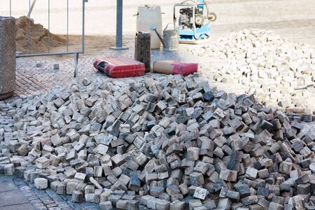 construction of pavement road with cobblestone granite stonesの写真素材