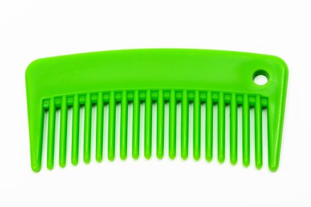 new green comb on a white backgroundの写真素材