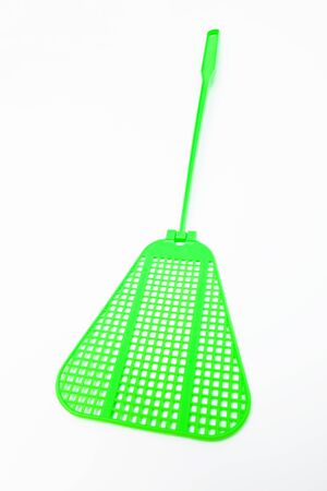 green fly swatter on a white backgroundの写真素材