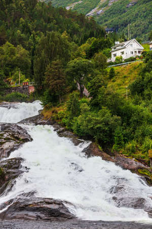 Hellesylt Fossen waterfall in the area Geirangerfjord in village Hellesyltの写真素材