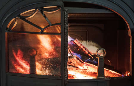 burning wood in the stove in a country house