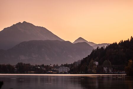 Autumn morning in the Bled Lake. The first rays of the sun illuminate the landscape. Bled Lake, the Upper Carniolan region of northwestern Slovenia.の写真素材