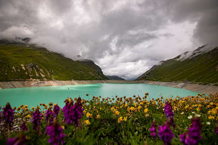 Aerial view of glacier lake at Lac de Moiry in the Swiss Alps. At Grimentz Vallis, CH Switzerland.
