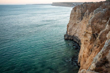 Stunning view over Praia do Camilo in Lagos, Algarve Portugal during the sunrise. Rocks, cliffs and formations in the ocean. Natural treasure. Portugalの写真素材
