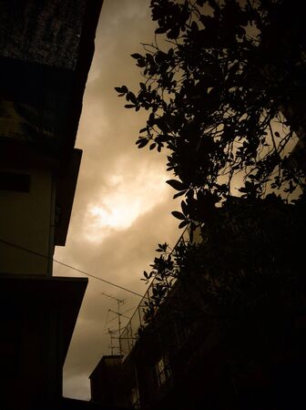 Slihouette building before storm comesの素材