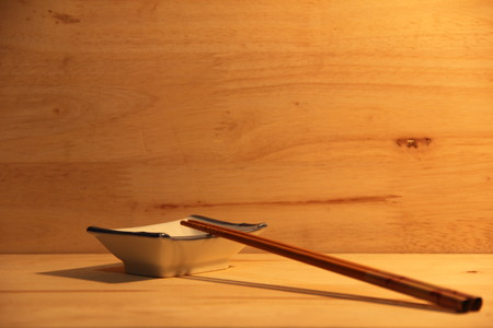 A plate of water with chopstickの写真素材