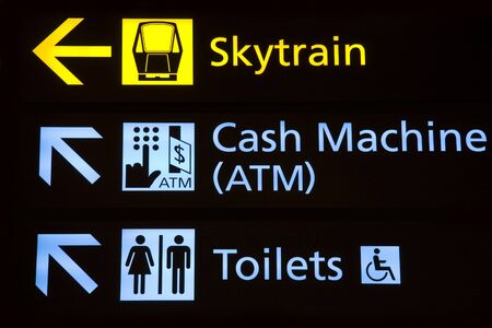 Directions to terminal connecting train, cash machine and restrooms at an airport