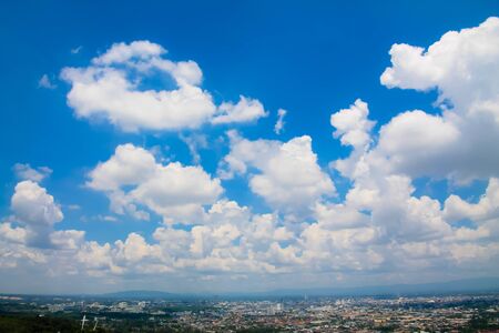 Fluffy Clouds in blue skyの写真素材