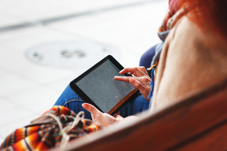 Female fingers touching tablet with map. Travel womanの写真素材