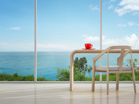 Sea view interior of home office with red coffee cup - 3d renderingの写真素材
