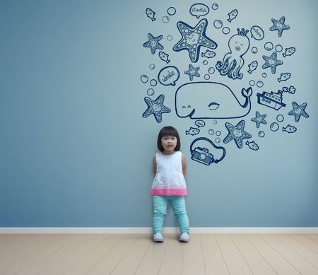 Funny asian child playing in blue room at home - 3d renderingの写真素材