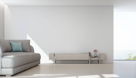 Sea view living room of luxury summer beach house with TV stand and wooden cabinet near big sofa. Empty white wall background in vacation home or holiday villa. Hotel interior 3d illustration.の写真素材