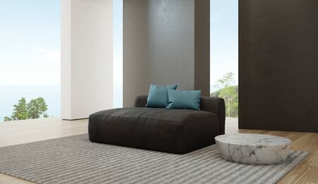 Sea view living room of luxury beach house with sofa on wooden floor. Black concrete wall background...