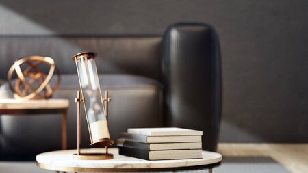 3d illustration of hourglass near books on marble coffee table with black sofa and dark concrete wall background. Living room in luxury house or hotel lobby.の写真素材