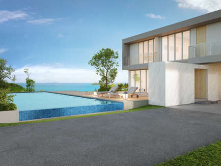 Luxury beach house with sea view swimming pool and big garden in modern design. Empty green grass lawn at vacation home. 3d illustration of contemporary holiday villa exterior.の写真素材