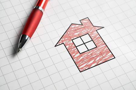 Real estate and selling or buying homes concept. Apartment for sale. Pen, paper and drawing of house.の写真素材