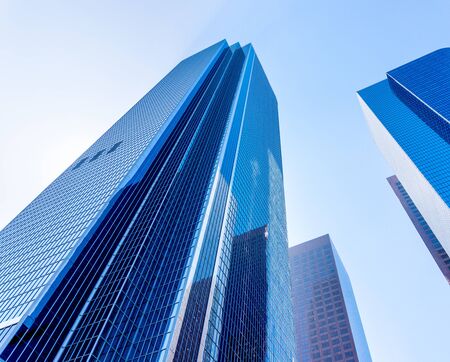 Tall office buildings view from down on the ground. High skyscrapers in a city.