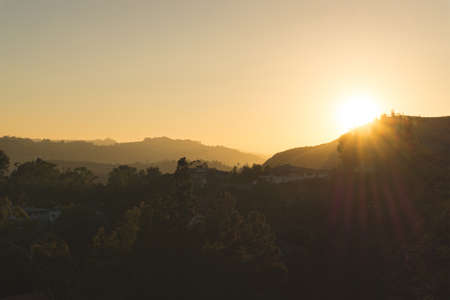 Golden hour sunset landscape view on hills.の写真素材