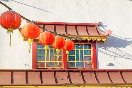 Traditional Chinese window and lanterns in Chinatown in an old building.の写真素材