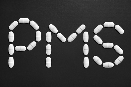 PMS text made from pills. Menstruation and having period concept.の写真素材