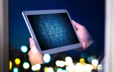 Dark web and cyber security concept. Man or hacker using tablet late at night. Internet fraud or...