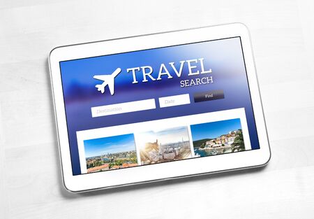 Travel search application or website on tablet screen. App to find cheap flights, hotel or holiday package on internet. Online travel agency web page.の写真素材