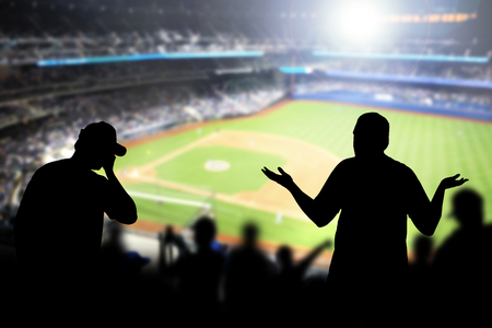 Sad baseball fans in stadium. Disappointed, angry and upset crowd in ballpark. Favourite team lost game. Devastated audience in live sport event. Angry silhouette people watching ballgame.の写真素材