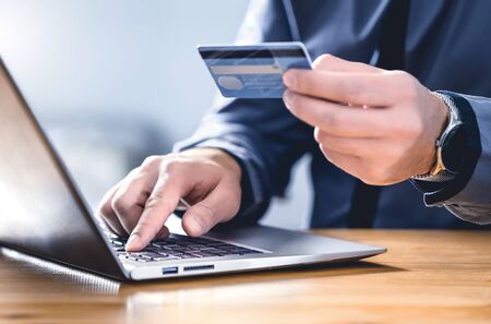Safe online payment and electronic money transfer security. Pay with digital technology. Man using...