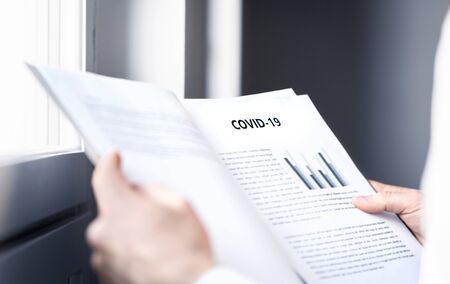 Coronavirus report about patient information or covid 19 impact on business finance market. Doctor...