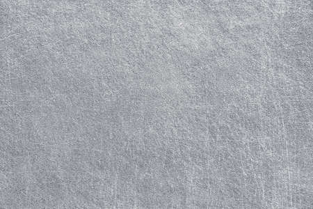 Rough urban grey concrete background with scratches. Old rustic cracked gray metal surface. Grunge...