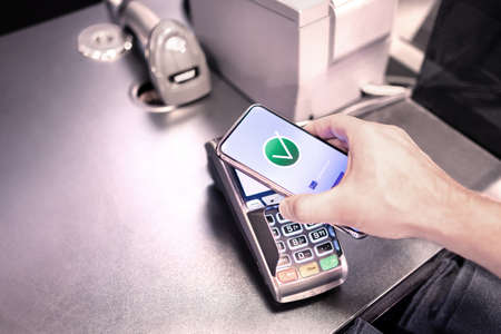 Payment with phone. Paying with contactless nfc mobile technology. Electronic wallet and bank credit...
