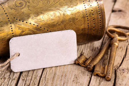 Blank label with old golden cup and keysの写真素材