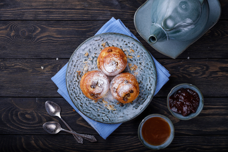 Puff buns on a blue plate.の写真素材