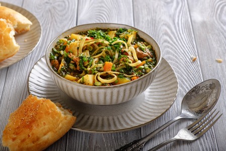 Soup lagman on a wooden table.の写真素材