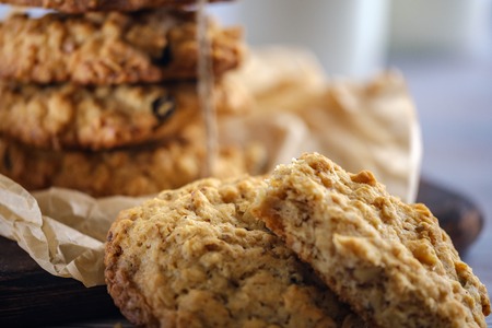 Healthy breakfast. Oatmeal cookies with milk on a wooden tableの写真素材