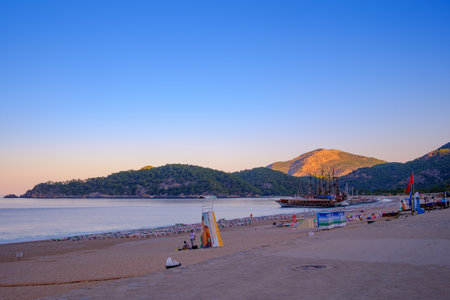 Oludeniz, Turkey - July 18, 2019 Ships are on the pier. Cafes and restaurants on the first lineのeditorial素材